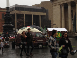 Christmas pudding on wheels in front of Sheffield's City Hall