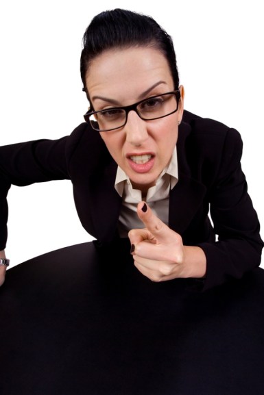 female holding up finger arguing wearing glasses