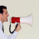 Businessman Speaking Through Megaphone